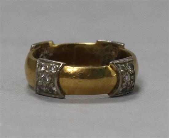 A diamond set gold band,